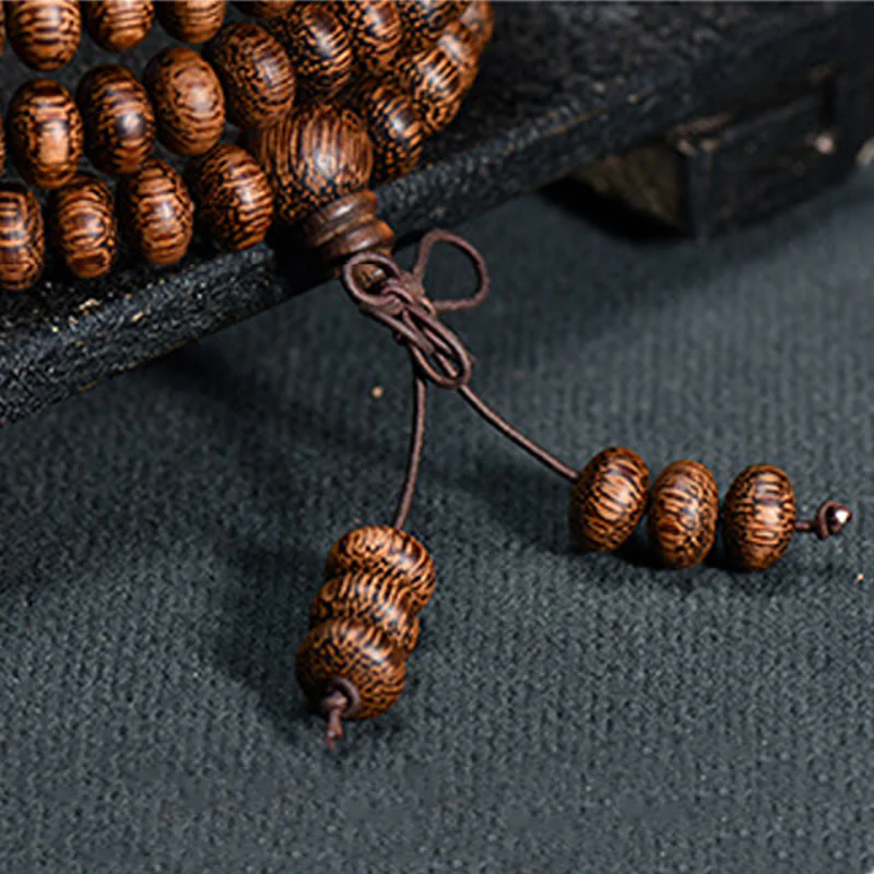 Buddha Stones Mala con 108 perline di legno testurizzate per un'energia calmante - Image 7