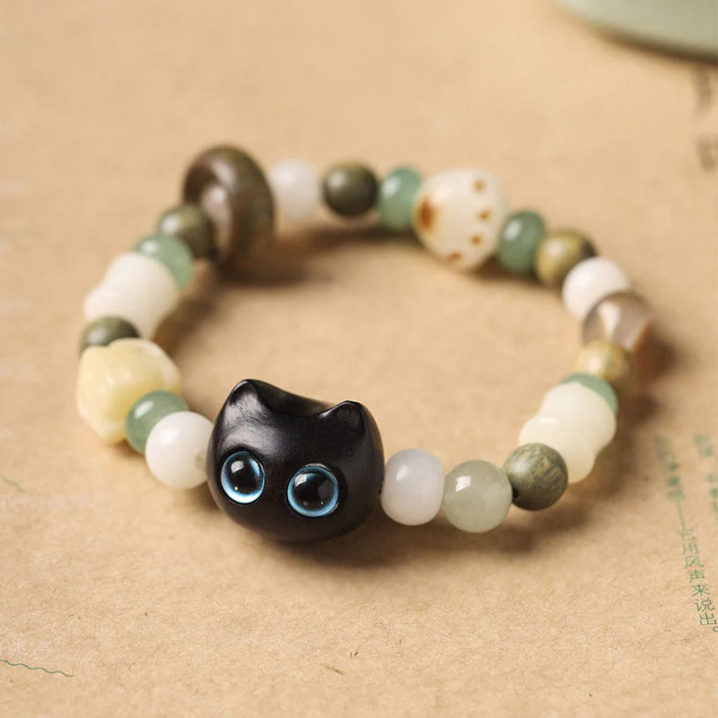 Buddha Stones Semi di Bodhi Sandalo verde Legno di ebano Foglia piccola Sandalo rosso Testa di gatto Zampa Artiglio Bracciale della pace