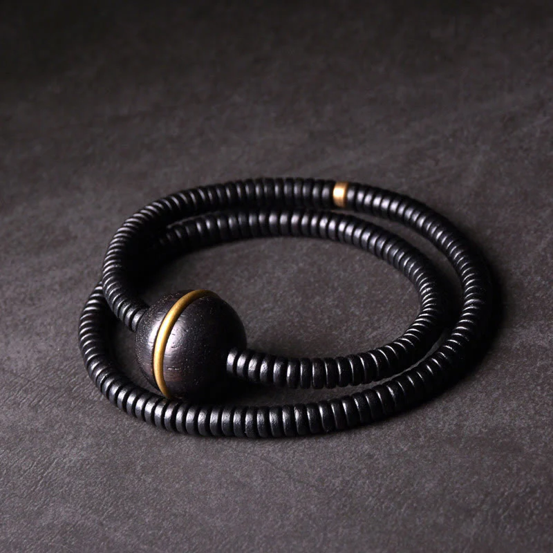 Collana con bracciale a doppio giro in Buddha Stones, in legno di ebano, in ottone e rame, con sfera di equilibrio cubica