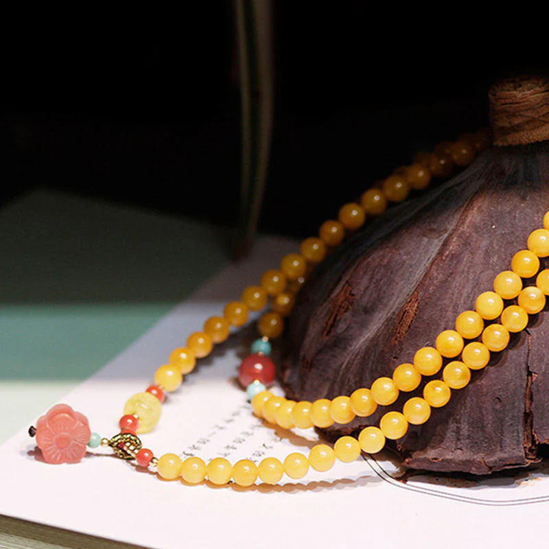 Collana con ciondolo a forma di fiore in ambra curativa e bilanciata - Image 4
