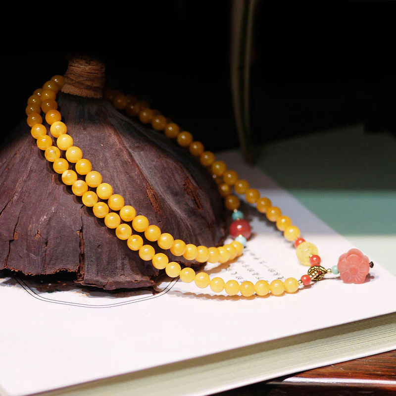 Collana con ciondolo a forma di fiore in ambra curativa e bilanciata - Image 5