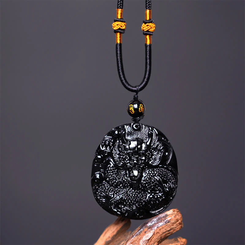 Collana con ciondolo di protezione in ossidiana nera naturale con drago intagliato rotondo in Buddha Stones - Image 4