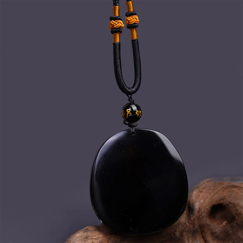 Collana con ciondolo di protezione in ossidiana nera naturale con drago intagliato rotondo in Buddha Stones - Image 6