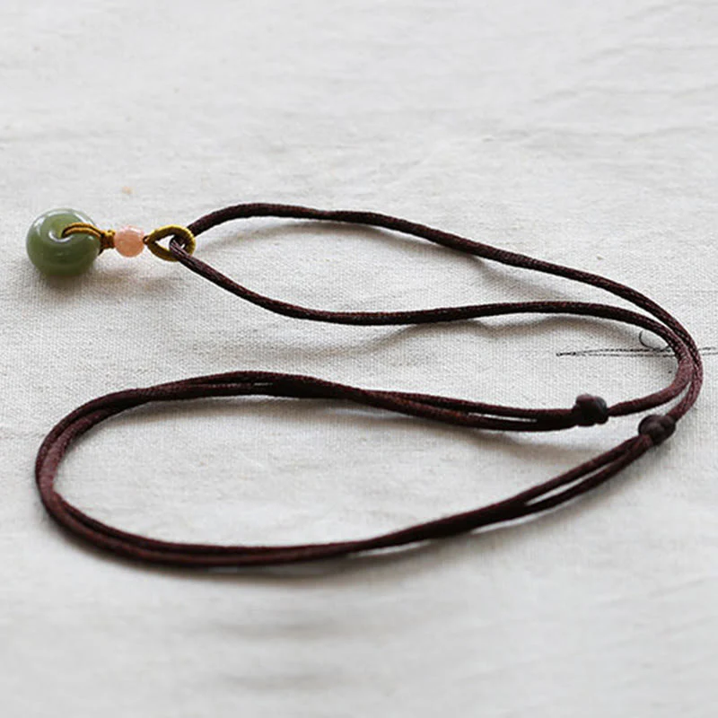 Collana con ciondolo in corda con fibbia della pace in giada rotonda naturale Buddha Stones Lotus Abundance - Image 12
