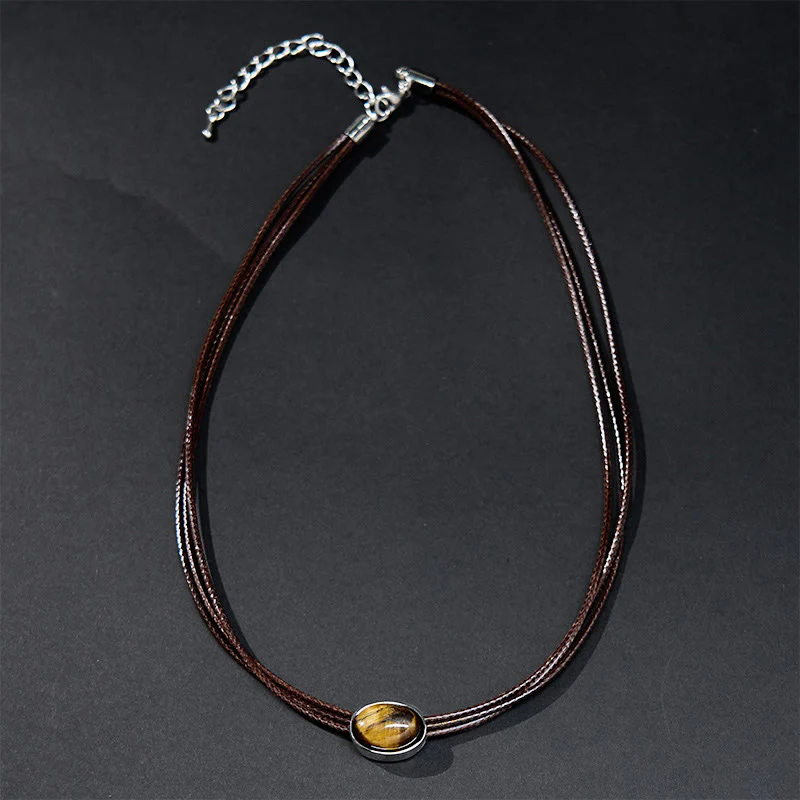 Collana con ciondolo in corda di cera con protezione ellittica in occhio di tigre naturale Buddha Stones - Image 2
