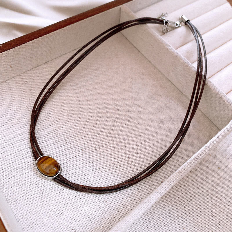 Collana con ciondolo in corda di cera con protezione ellittica in occhio di tigre naturale Buddha Stones - Image 9