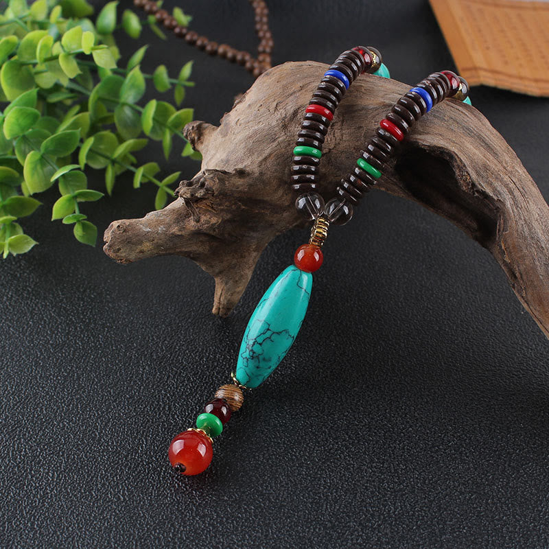 Collana con ciondolo in pietra turchese, pietra di legno di wenge, protezione e calma Buddha Stones - Image 2