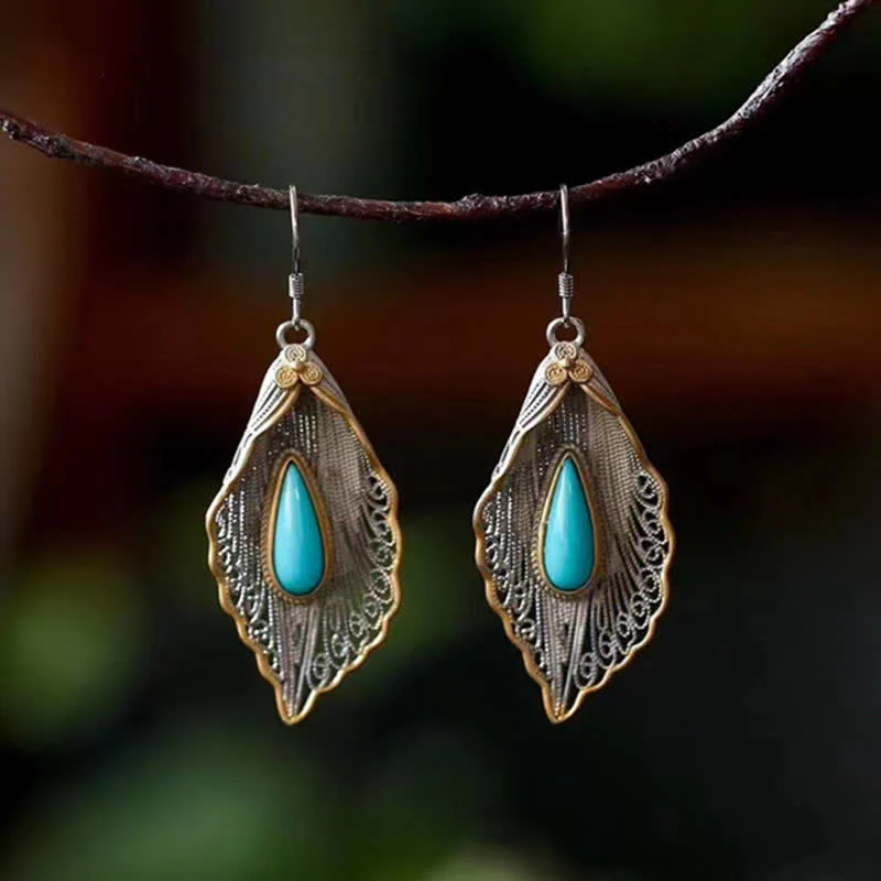 Orecchini pendenti con motivo a foglia di Bodhi in argento sterling 925 con Buddha Stones e turchese