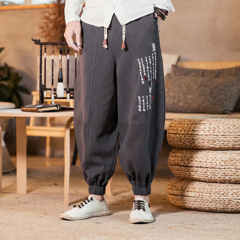 Pantaloni da uomo in cotone con tasche e motivo a caratteri cinesi ricamati con Buddha Stones